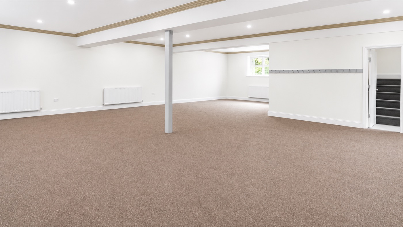 Inside the main hall — a bright, open carpeted space